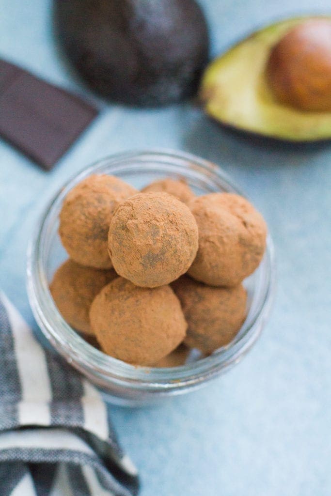 A glass dish filled with healthy chocolate truffles