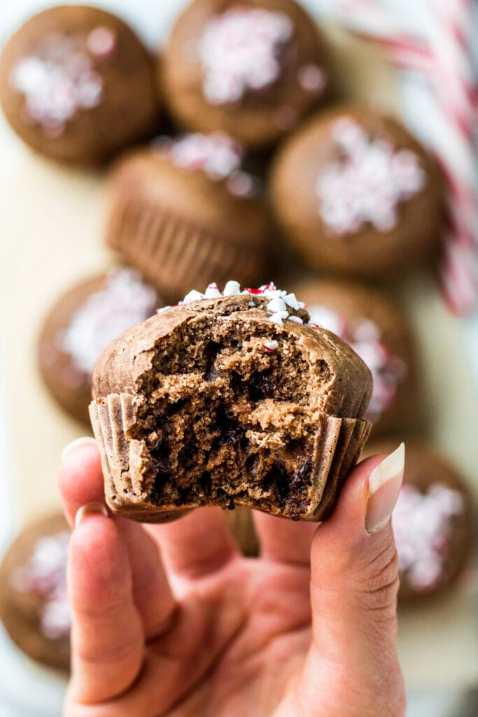 A close up of a peppermint muffin with a bite taken out of it.