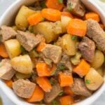 Paleo Beef Stew in a white bowl on a grey background
