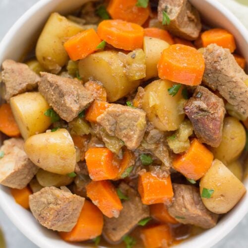 Paleo Beef Stew in a white bowl on a grey background