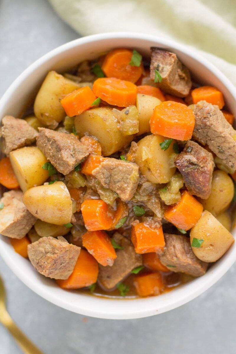 Paleo Beef Stew in a white bowl on a grey background
