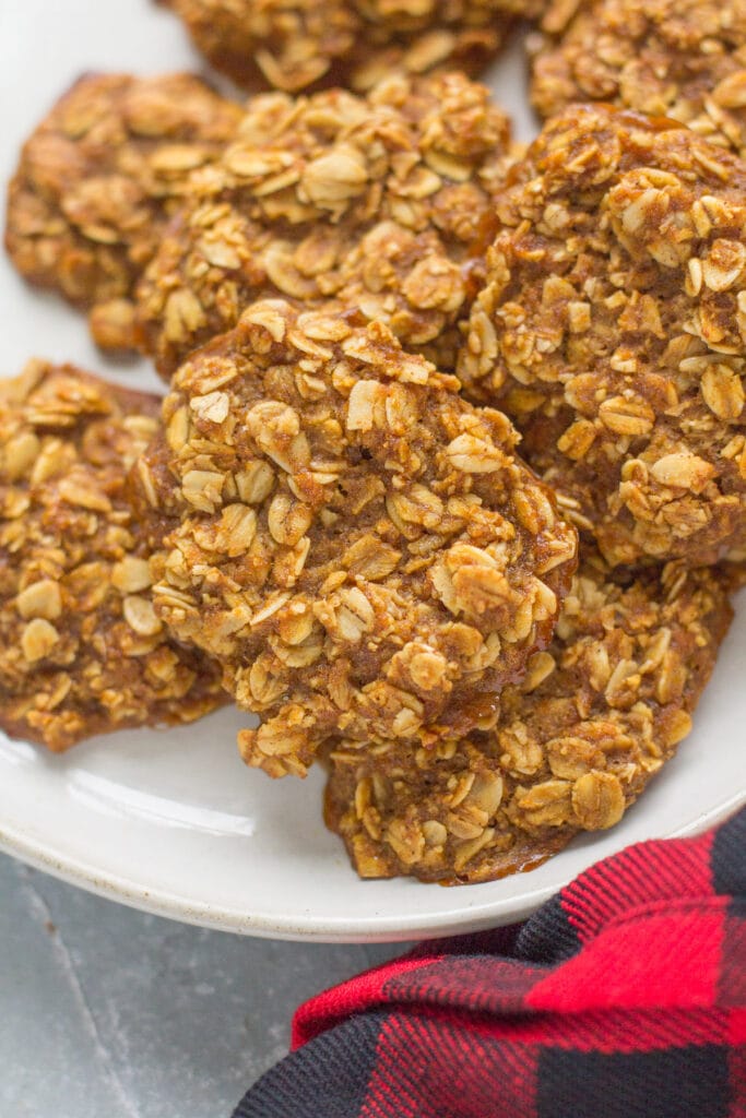 a close up of healthy gingerbread breakfast cookies on a white plate. 