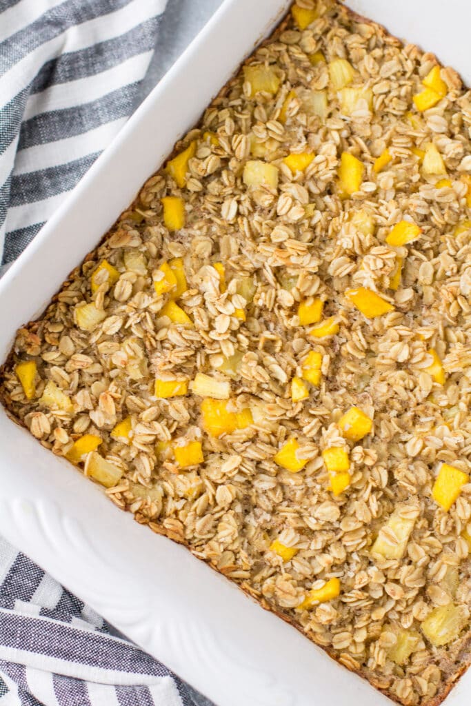 An overhead shot of Mango oatmeal in a white baking dish.