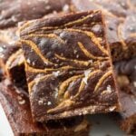 A close up of Almond Butter Brownies on a white plate