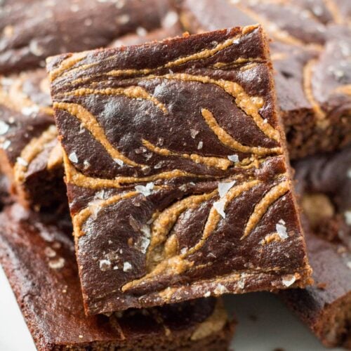 A close up of Almond Butter Brownies on a white plate