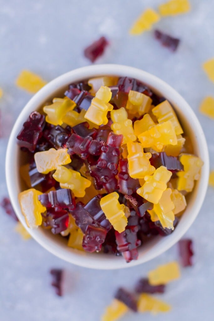 Healthy Gummy Bears in a small white bowl on a grey background
