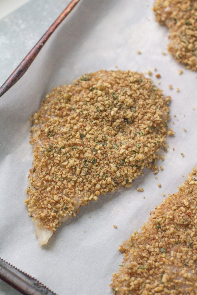 pecan crusted chicken before being baked in the oven
