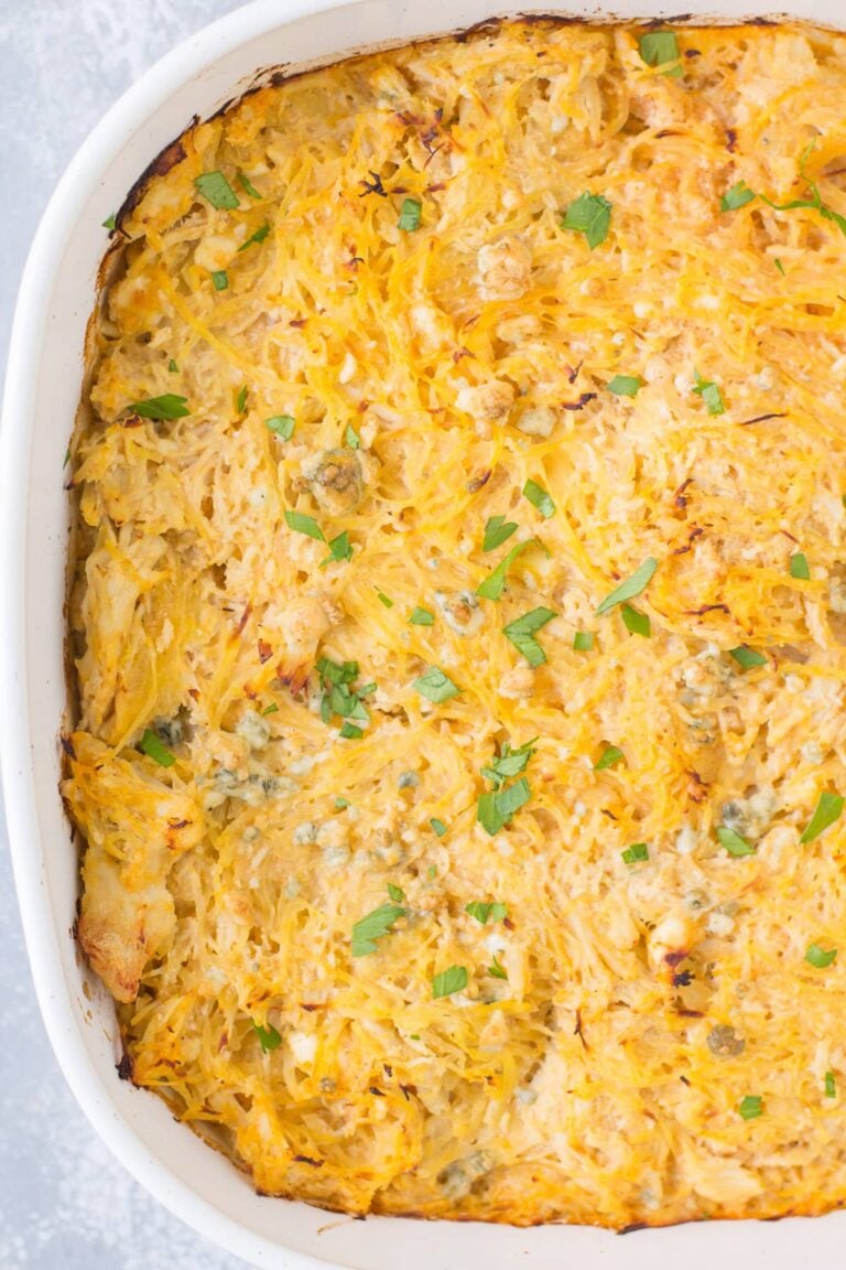 Buffalo Chicken Spaghetti Squash Casserole in a white dish on a grey background.