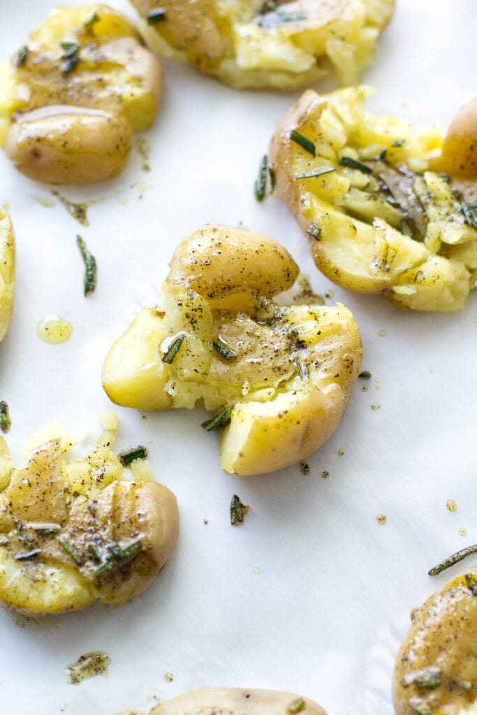 A close up of easy smashed potatoes before they head into the oven to be baked