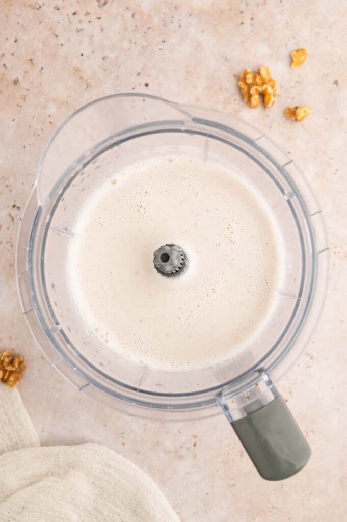 Walnut milk freshly processed in a blender.