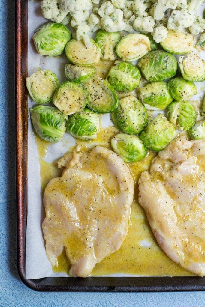 Whole30 Sheet Pan Chicken Dinner with brussels sprouts and cauliflower