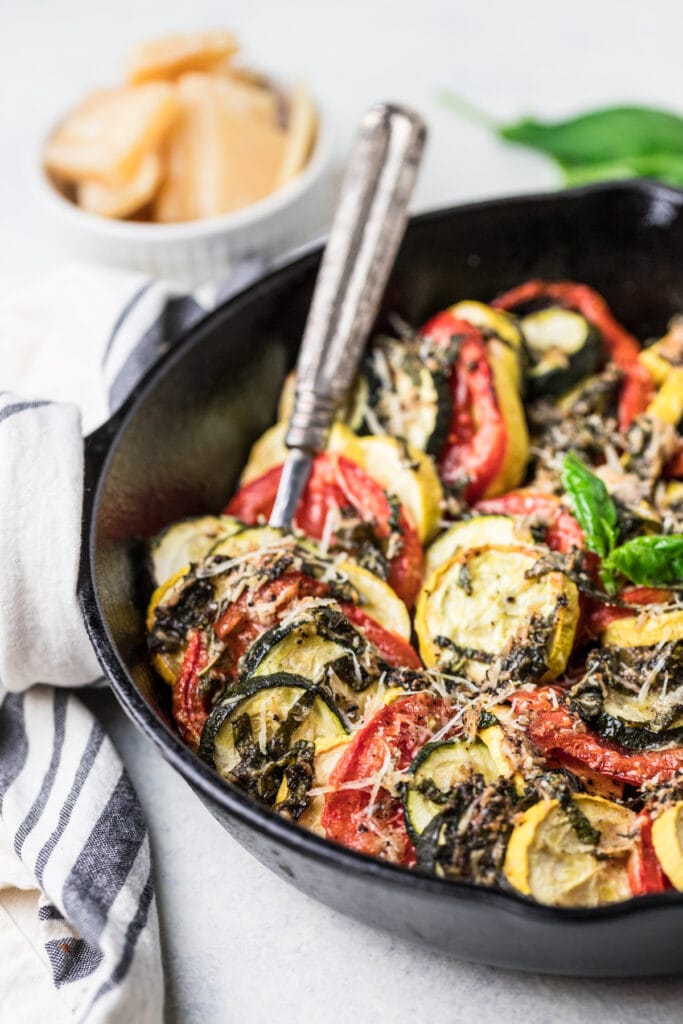 a spoon taking a scoop out of zucchini bake