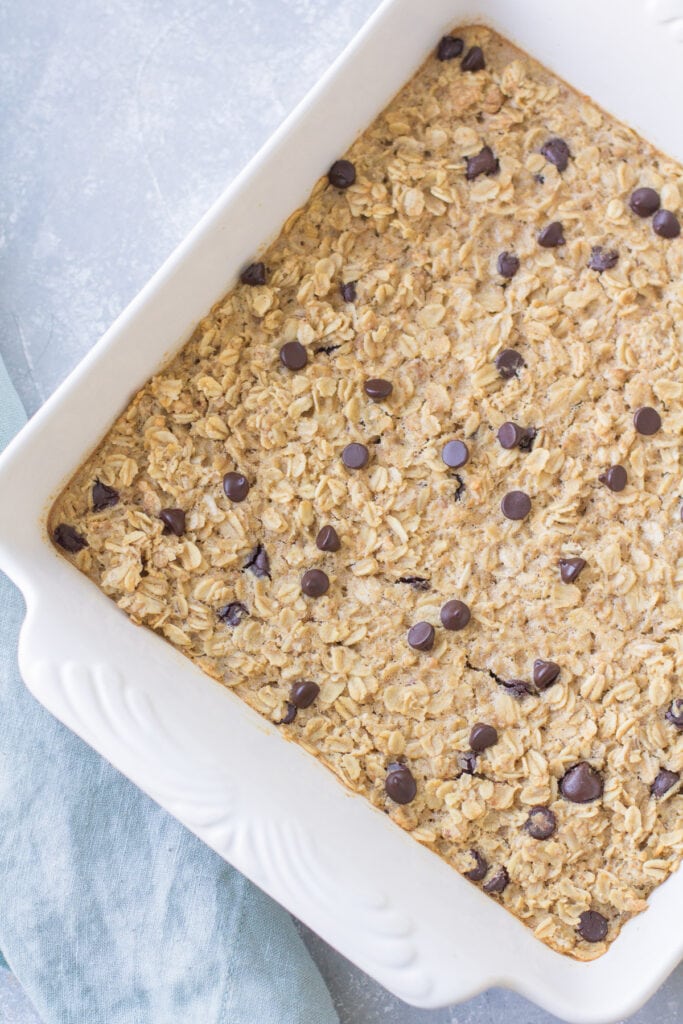 An overhead shot of Chocolate Peanut Butter Oatmeal in a white baking dish