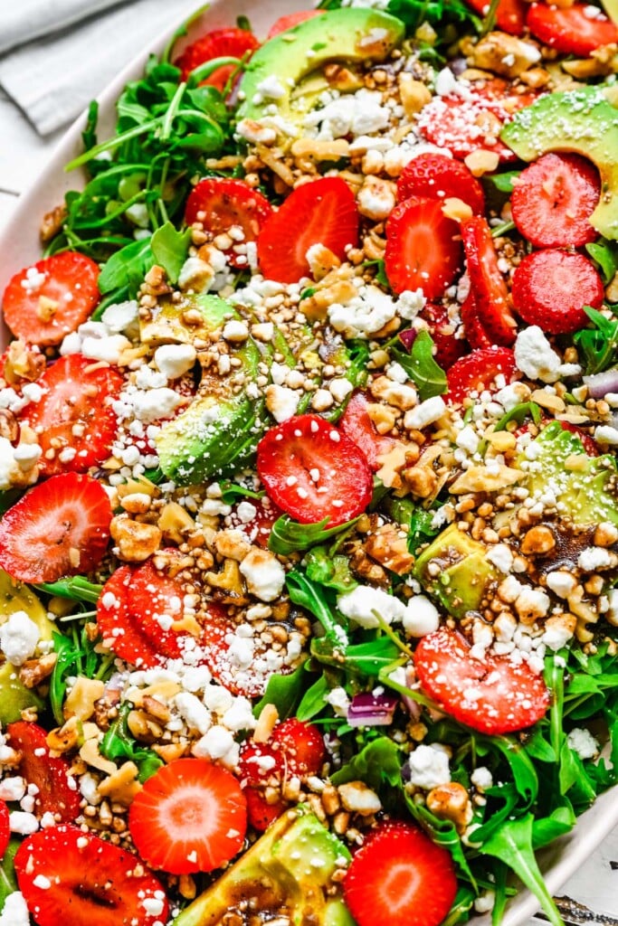 A close up of a strawberry goat cheese salad