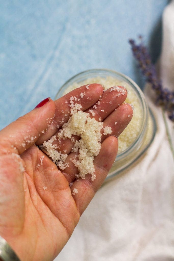 Hand holding up DIY Sugar Scrub
