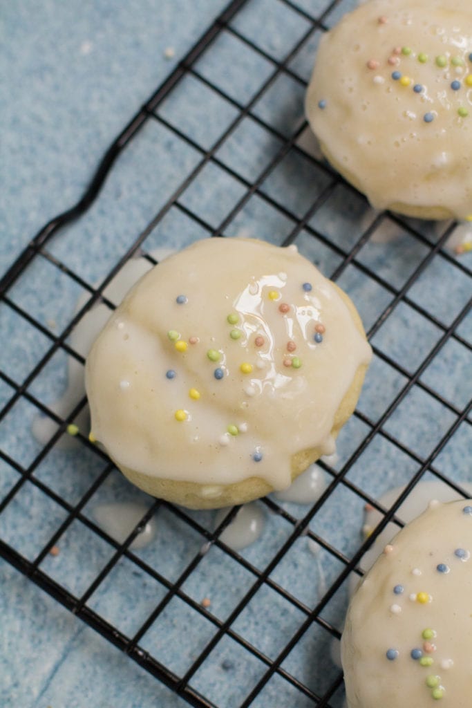 Healthy Anginetti Cookies on a black cooling rack.