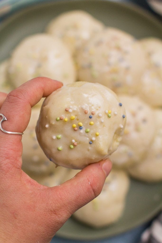 A hand holiding up Healthy Anginetti Cookies to the camera