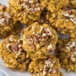 Healthy Pumpkin Breakfast Cookies on a white plate with a grey background and a blue linen in the back