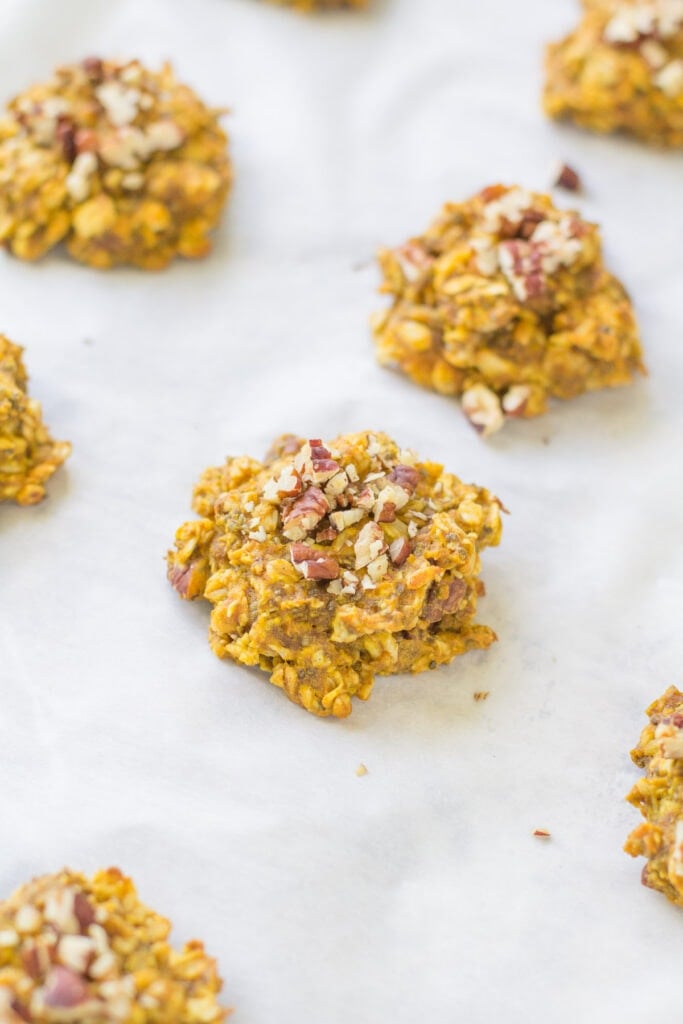 Pumpkin Oatmeal Breakfast Cookies on a parchment paper prepared baking sheet
