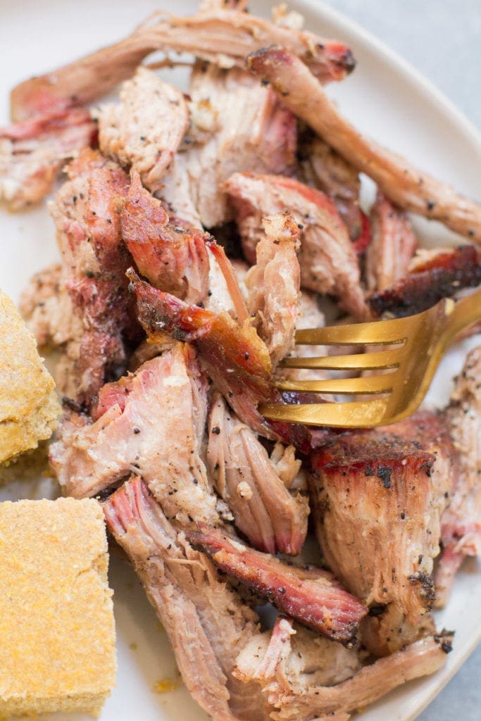 Coffee BBQ Pulled Pork on a plate with cornbread.