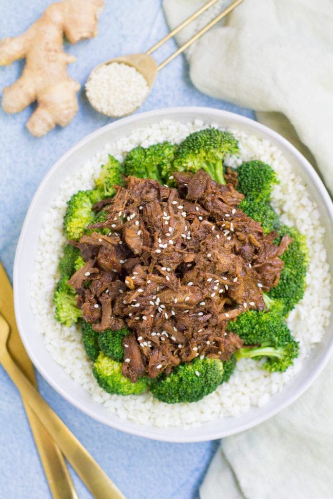 A top down view of a big bowl of healthy slow cooker beef + broccoli