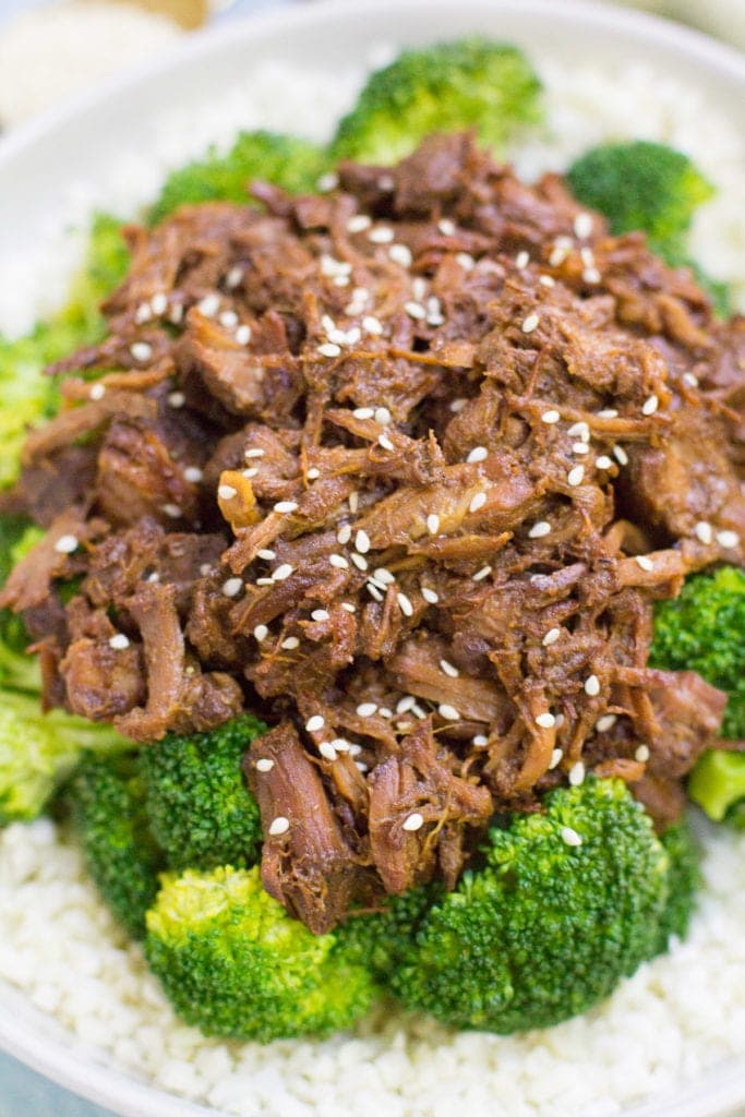 A close up photo of healthy slow cooker beef and broccoli over cauliflower rice