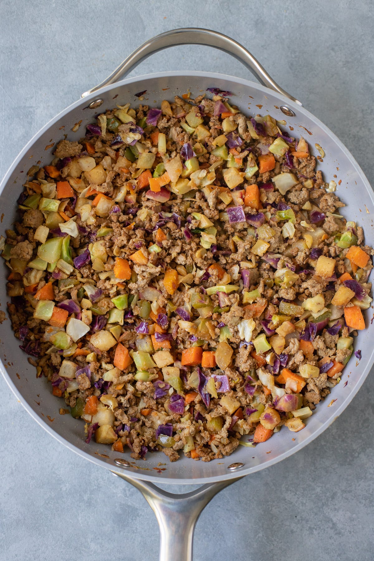 Ground Turkey Skillet dinner in a pan on a grey background