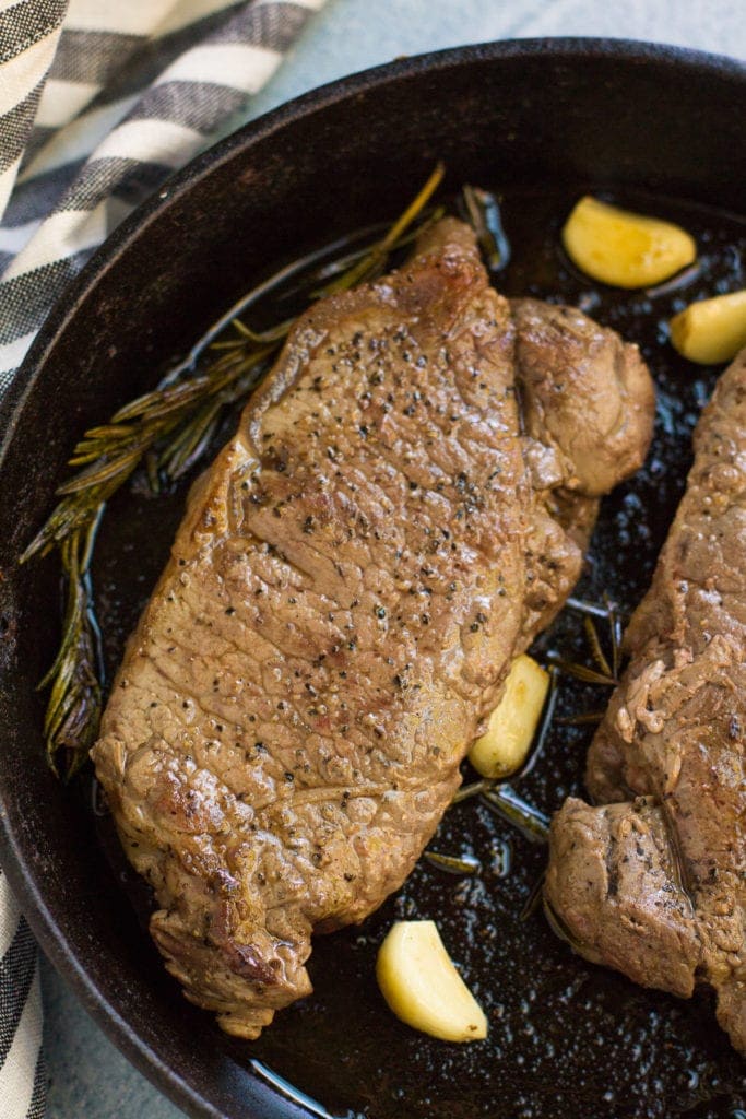 A Cast Iron Steak cooked perfectly in a skillet