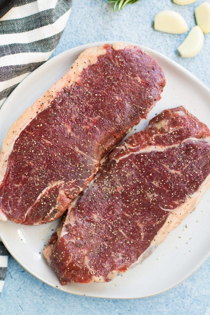 Butcher Box Steaks getting ready to be cooked in a cast iron skillet