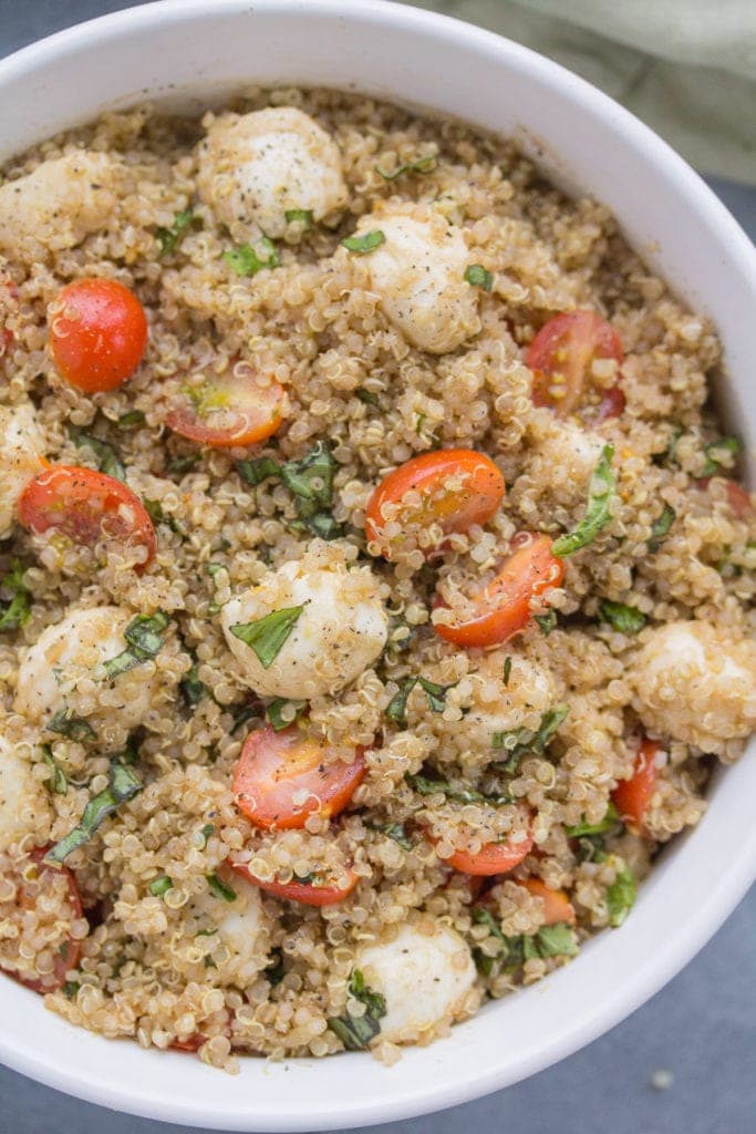 A close up of quinoa salad ready to be turned into Chicken Caprese Quinoa Meal Prep Bowls