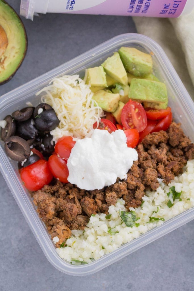 Taco cauliflower rice bowls in meal prep containers