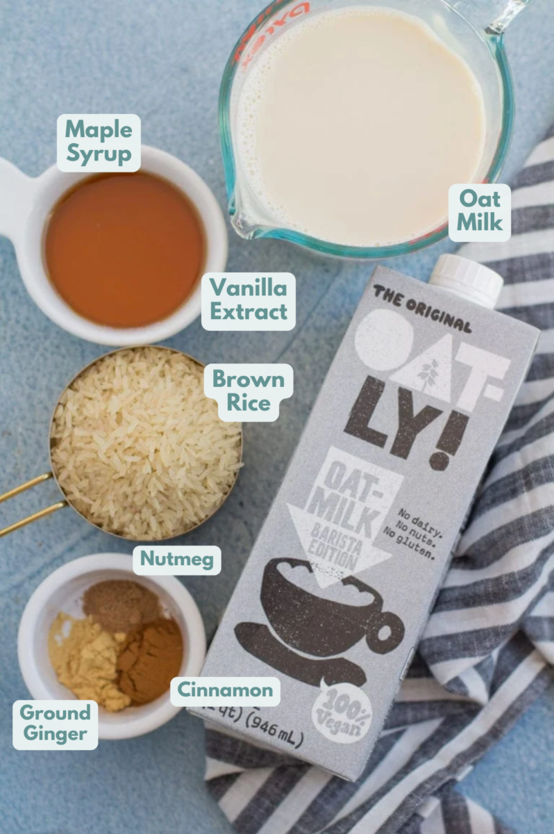 Ingredients to make vegan rice pudding. oatmilk, maple syrup, rice, and spices.