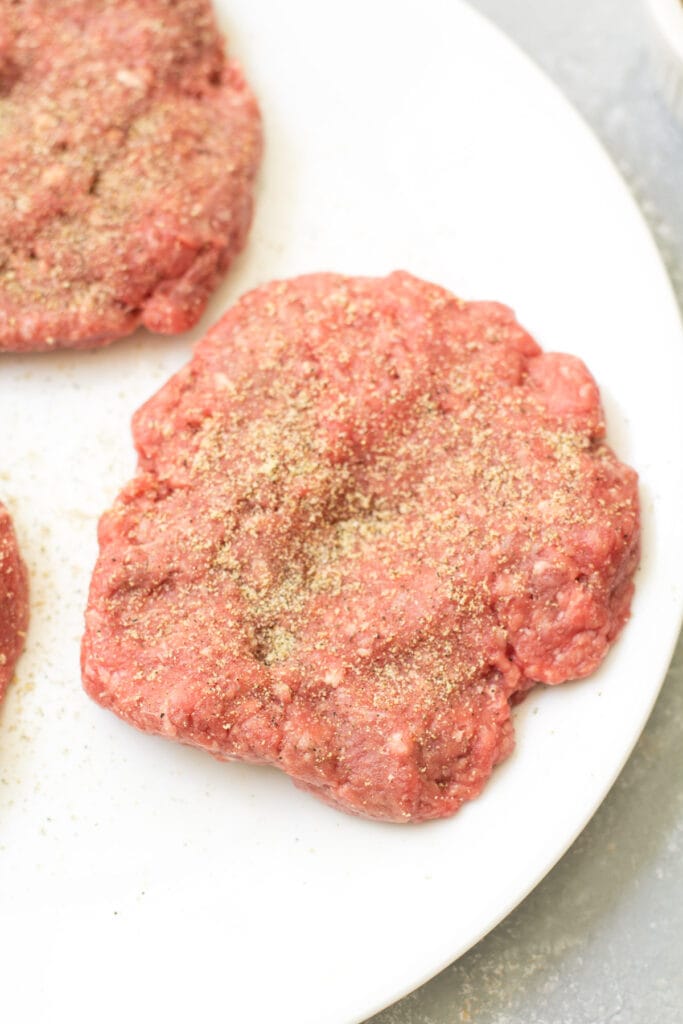 instructions on how to season a burger with a seasoned ground beef patty