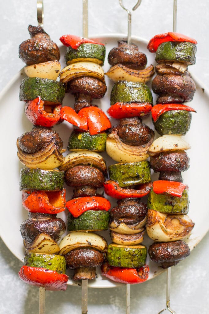 paleo vegetable kebabs on a white plate