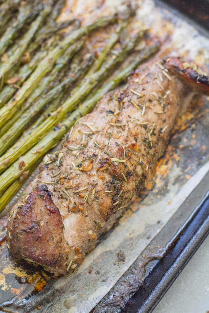Close up of Italian Pork Tenderloin Sheet Pan Dinner on a baking sheet