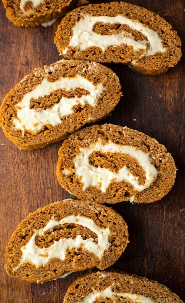 paleo pumpkin roll on a wooden cutting board- healthy pumpkin recipes