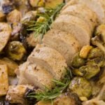Apple Pork Tenderloin Sheet Pan Dinner on a sheet pan with rosermary