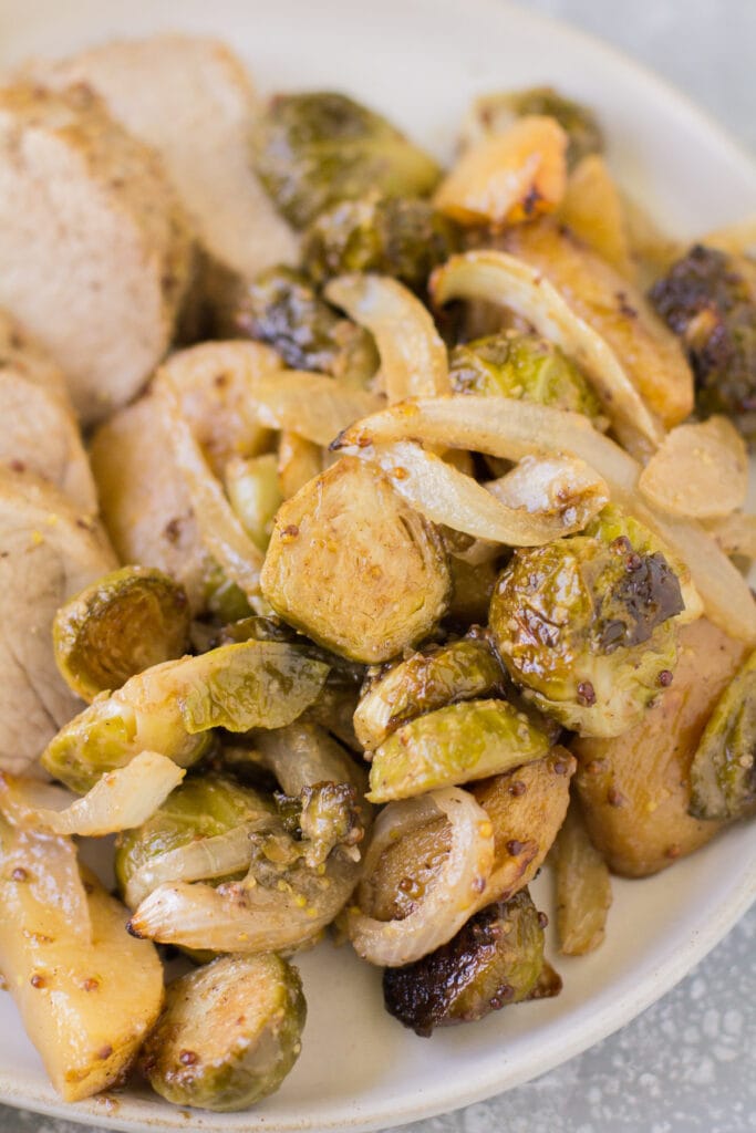 Close up of veggies from apple pork tenderloin sheet pan dinner