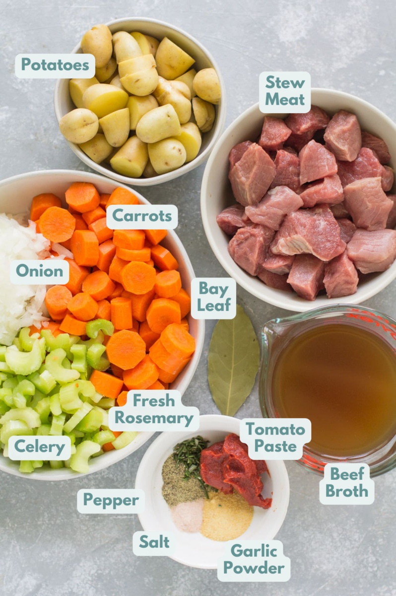 Ingredients for Paleo Beef Stew in small white bowls laid out on a grey background