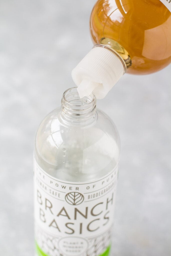 Pouring branch basics concentrate into a bottle