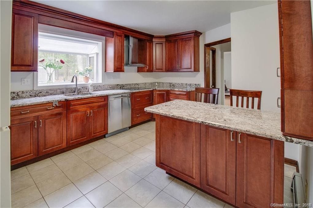 Kitchen Renovation - side profile of old island with white tile floor