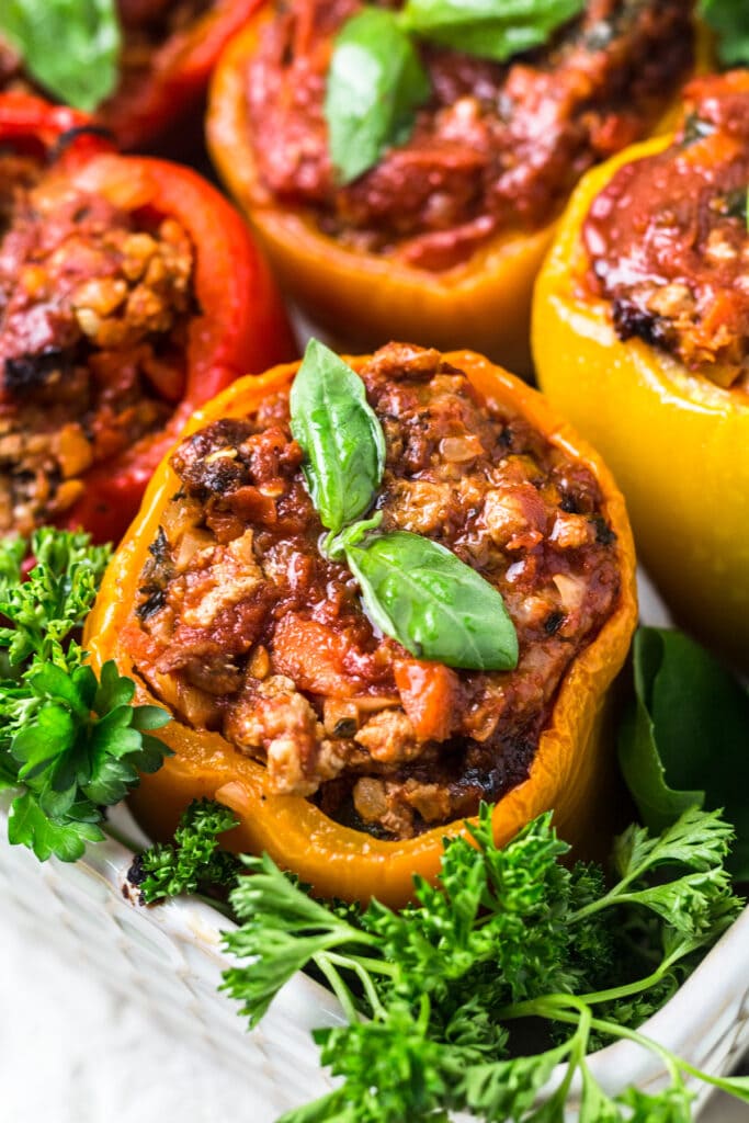 A close up of whole30 stuffed peppers with cauliflower rice