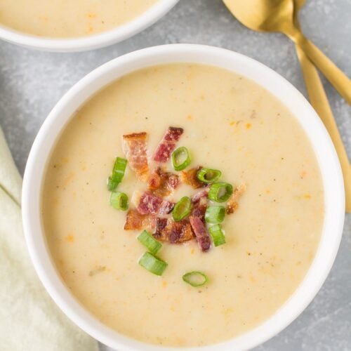Healthy Potato Soup in a white bowl on a grey background