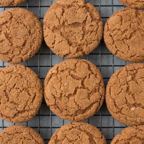 A close up of The BEST Crispy Gingersnap Cookies on a cooling rack