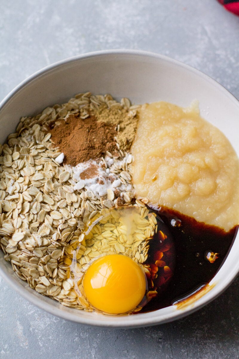 All ingredients for gingerbread breakfast cookies in a bowl before mixing.