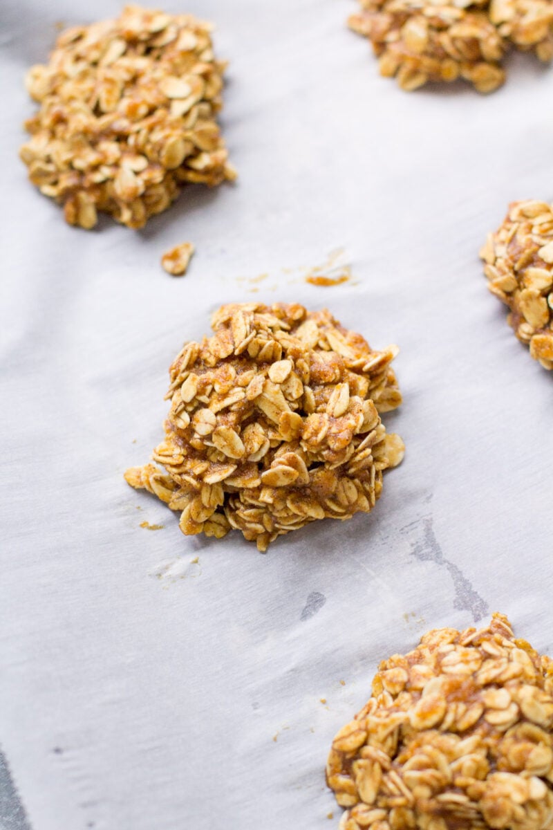 Unbaked Gingerbread Breakfast Cookies on a parchment lined baking sheet.