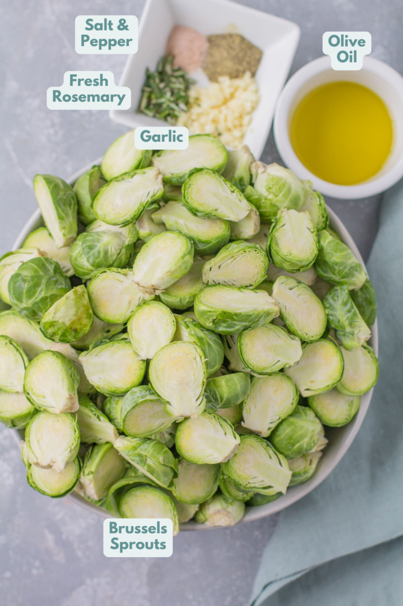 ingredients for Garlic Roasted Brussels Sprouts - halved brussels sprouts, olive oil and spices laid out in small white bowls