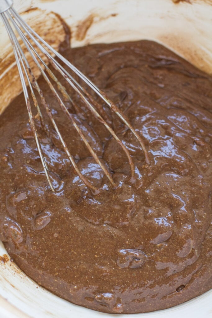 almond butter brownie batter being mixed together