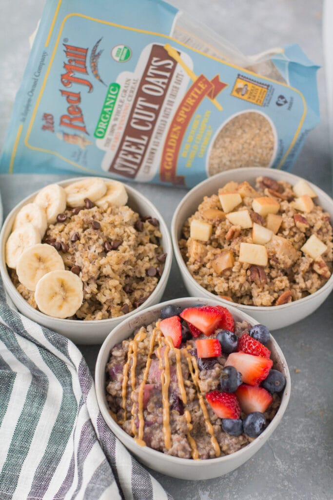 Baked Steel Cut Oatmeal in small bowls with a bag of steel cut oats in the background