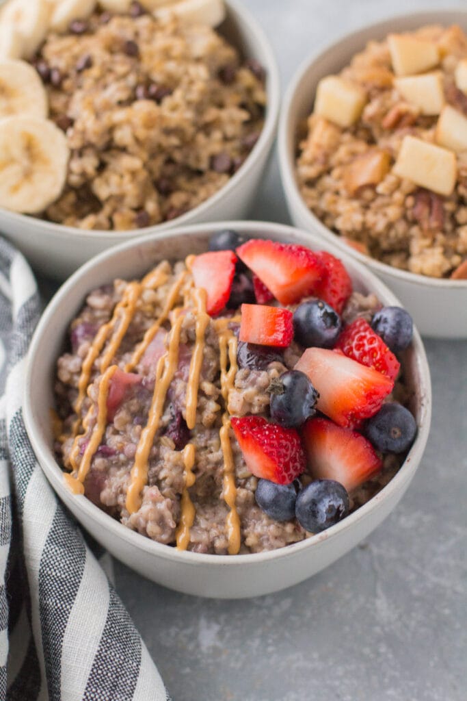 3 white bowls filled with baked oatmeal made with steel cut oats